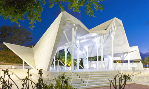 Ron Shenkins cemetery meeting space is a mountain like concrete canopy in Israel 889x535